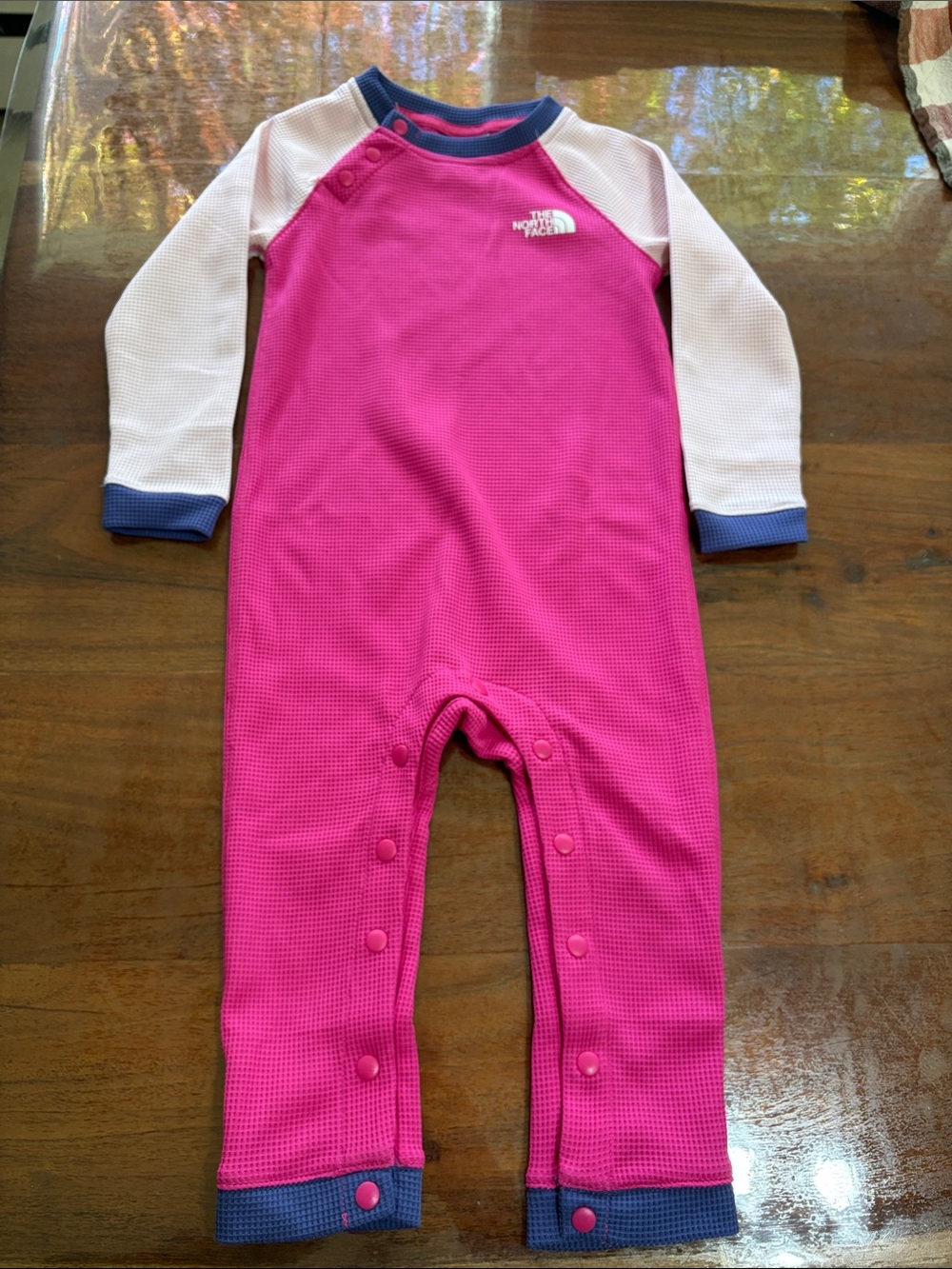 The North Face Pink Waffle Thermal One-Piece with Pink Sleeves and Purple Trim